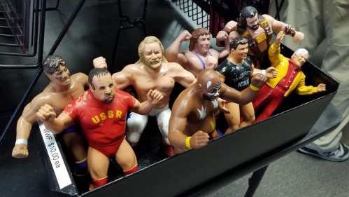 Wrestling action figures standing in a box